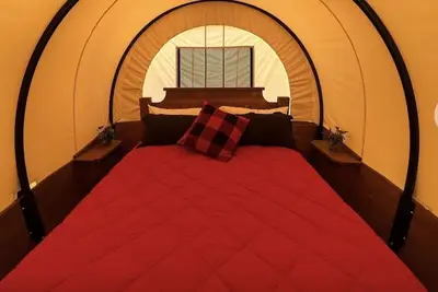 Stay in a unique Conestoga Wagon with room for 4