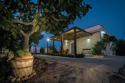 Image de Vacation House \"Ulivi nel Mare\" typical country home, surrounded by olive trees.