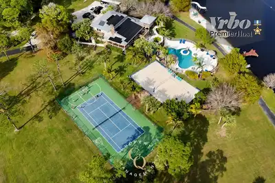 Image de 2 Home Sport Complex W/ Private Lake & Theater!