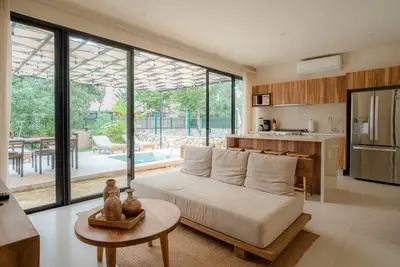 Image de Sun-soaked & modern beach getaway with pool, generous patio, gym, & great views