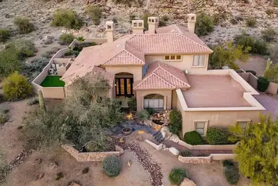 Image de Enjoy breathtaking views of the mountainside throughout this hillside estate.