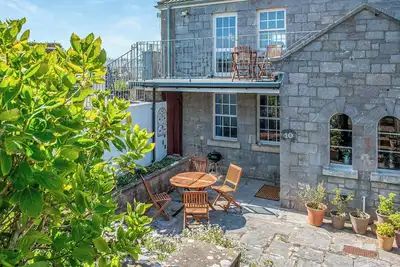 Image de A historical hidden gem of a property within walking distance to the water’s edge at Devils Point.