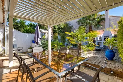 Image de Maison de vacances 'Les Palmiers' avec terrasse privée, Wi-Fi et climatisation