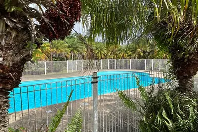 Image de Kanoa Lodge - spacieux appartement, chambres climatisées, terrasse vue mer