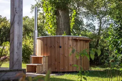 Image de Tiny but extra finy, because of the hot tub at the cottage!