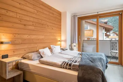 Image de Appartement 'Ciasa Majonade Pozza Di Fassa Tipo2' avec vue sur la montagne, jardin partagé et Wi-Fi