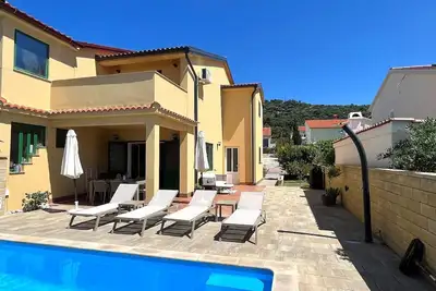 Image de Maison de vacances Barbat na Rabu pour 1 - 6 personnes avec 3 chambres à coucher - Maison jumelée