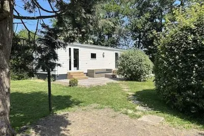 Image de A brand new chalet on one of the most beautiful plots in the park with private parking, free Wifi, central heating and dishwasher.
