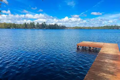 Image de Dog-friendly lakefront property with dock, boat lift, firepit, & two kitchens
