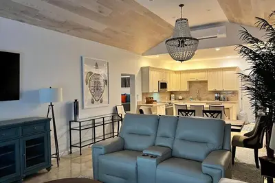 luxuries, leather couches, wine cooler, covered porch with a grill, free WiFi.