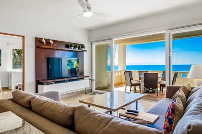 Beachfront condo with ocean view, pools, gym, game room, & private balcony