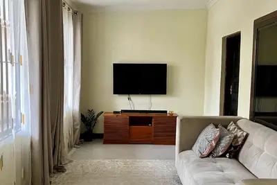 Image de 5 minutes drive ti Mlimani City Shopping Mall. Family sized close to the road