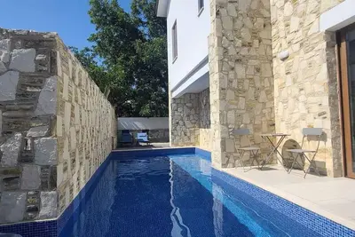 Olive Garden's Paradise Villa with private swim up pool and picturesque village.