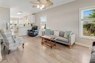 Image de 2-story dog & snowbird-friendly home with sound views, balconies, deck, & W/D