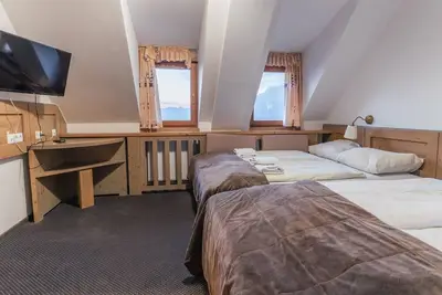 Krvavec Quadruple room 4