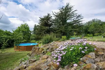 Image de Gîte Domaine de La Blanche Hermine - Le Cornouaille - 10 Personnes' avec piscine, poele à bois