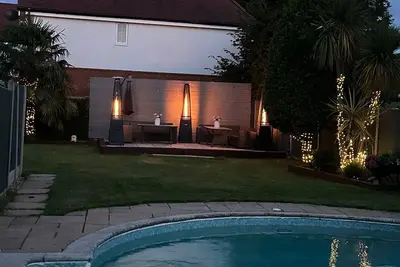A serene quiet oasis with 3 separate buildings large garden & heated pool