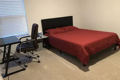 A master bedroom suite with its own bathroom and kitchen