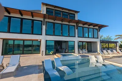 Beachfront estate home with private 70’ dock and 7500sq ft. of living space