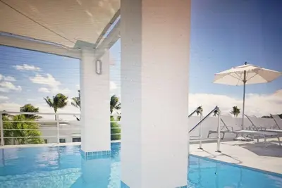 Townhome located at Coral Beach Club on the ocean with full amenities.