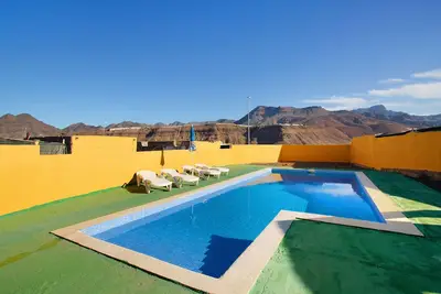Image de Maison de vacances 'Villa Paraiso Aldeano 1' avec vue sur la montagne, piscine partagée et Wi-Fi