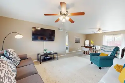 Single-level vacation home with fenced yard, furnished patio, & washer/dryer