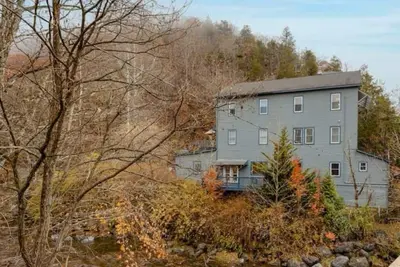 Image de Dog-friendly, riverfront home with games galore, pool, & mountain view