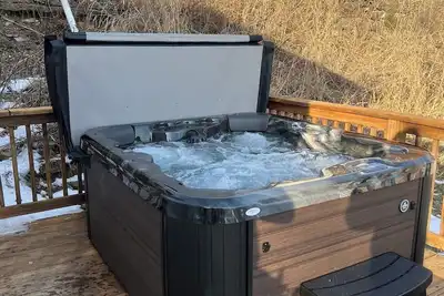 Image de Private deck with hot tub and fire pit.