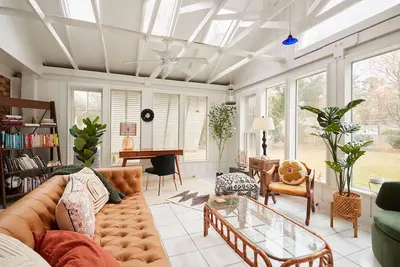 Image de Quiet home with sunroom, modern amenities, fenced in yard, Ev Charging, & more!