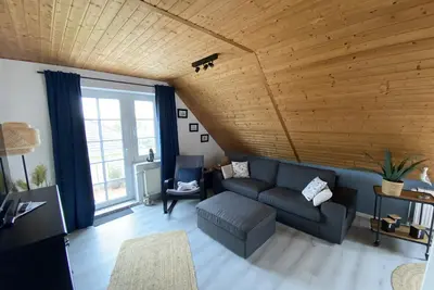 Image de Cozy vacation apartment with balcony in the heart of the seaside resort of Nessmersiel. wallbox