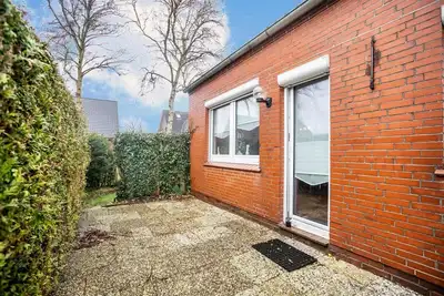 Image de The vacation apartment Niedl App Helene 2 is located in Neßmersiel and is perfect for an unforgettable vacation with your loved ones.