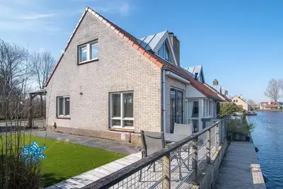 Image de Cozy, modernly furnished holiday home with a nice terrace and a jetty