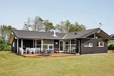 Image de Maison de vacances pour 9 a Blokhus-By Traum