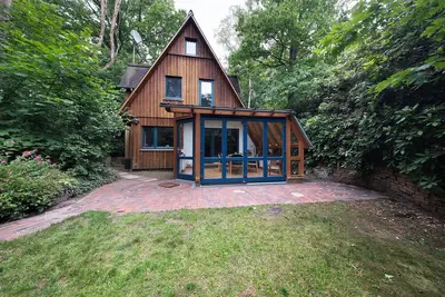 Image de Maison de vacances 'Ferienhaus Am Brandorffsee' avec vue sur lac, terrasse privée et jardin privé