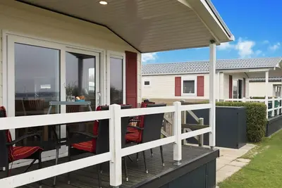 Image de Ostseechalet Strandmuschel - Direkter Meerblick, Ăśberdachte Terrasse, Parkplatz