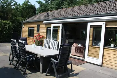 Image de Dune Chalet with sunny terrace directly against the dunes for 2 persons+ Baby