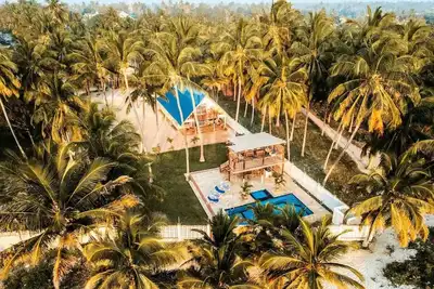 Karibu Beach Villa - A private beach front home with a large pool and garden\n\n