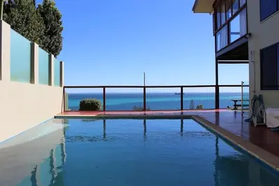 Image de Banyandah Waters Beach House! \nPrivate inground Pool with stunning ocean views!