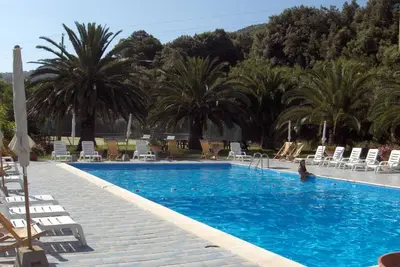 Image de Monolocale in complesso condominiale con uso di piscina.