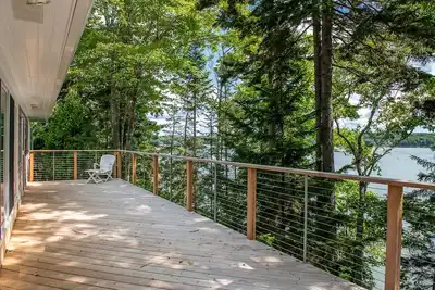 New! Coastal Hideaway. Water views with expansive deck, pool table, office area.