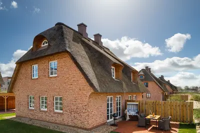 Image de Reetlodge an den Schleiterrassen - Kamin, Terrasse, Strandkorb, Wasserblick