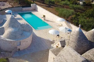 Image de Appartement \"Trullo Mandorlo\" avec piscine partagée, terrasse privée et Wi-Fi