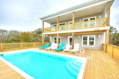 Image de New 5br/4. 5BAHouse, Marsh Views, Dog Friendly, Pool, Sleeps 12