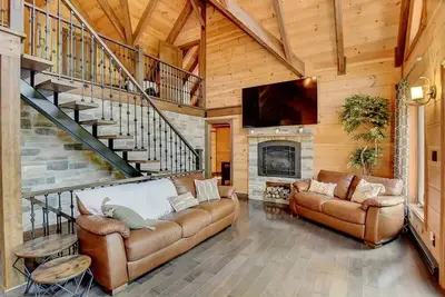 Luxurious chalet featuring a jacuzzi, pool, small lake, sauna and pool table.