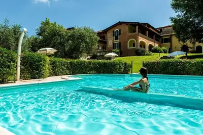 Image de Villa Santa Caterina - Appartement de trois pièces avec vue jardin et piscine