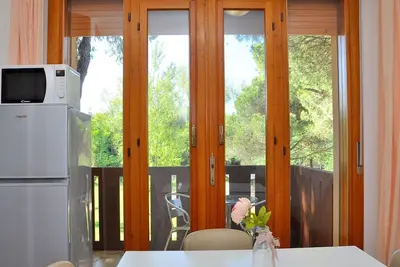 Image de Appartement confortable avec terrasse à côté de la plage-Beahost