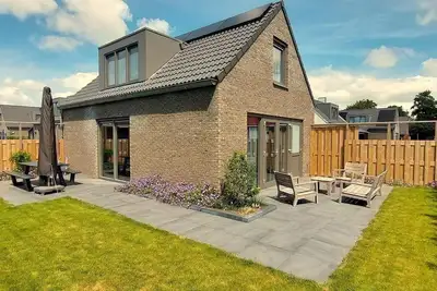 Image de Child-friendly, but above all luxurious holiday home near the sea and dunes. The house is fully equipped.