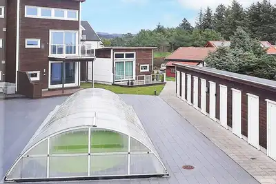Image de Maison de vacances pour 4 a Farsund-By Traum