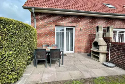 Image de Appartement 'Ferienhaus Seehund' avec terrasse privée, jardin partagé et Wi-Fi