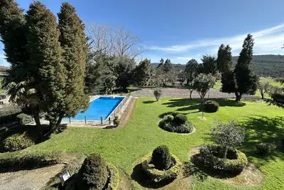 Image de Explore Finca Espinal a retreat with pool and lush gardens.